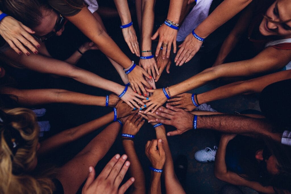 overlapping hands sharing accountability