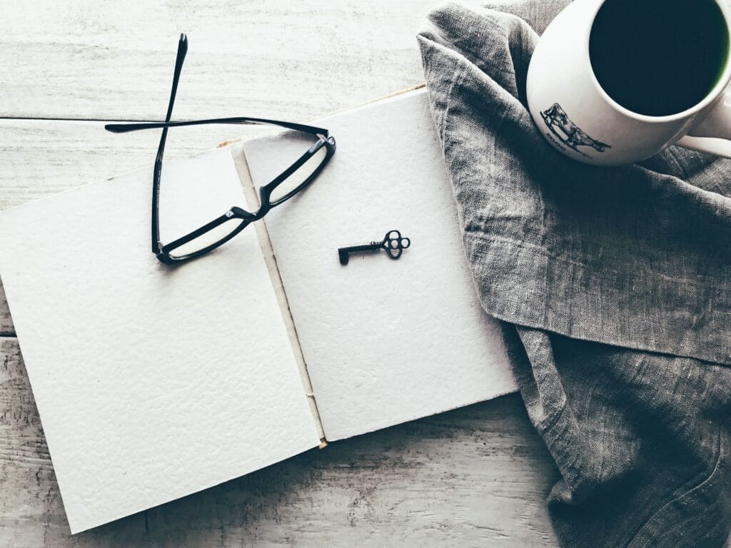 open notebook and eyeglasses for insider secrets
