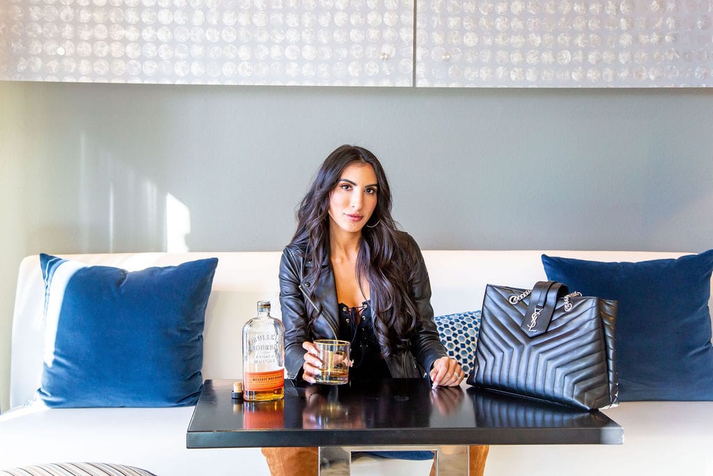 woman sitting in a couch and drinking for BI Unfiltered